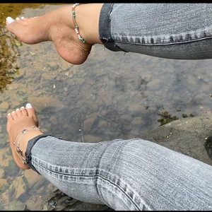 Legs tease and white toes on the river